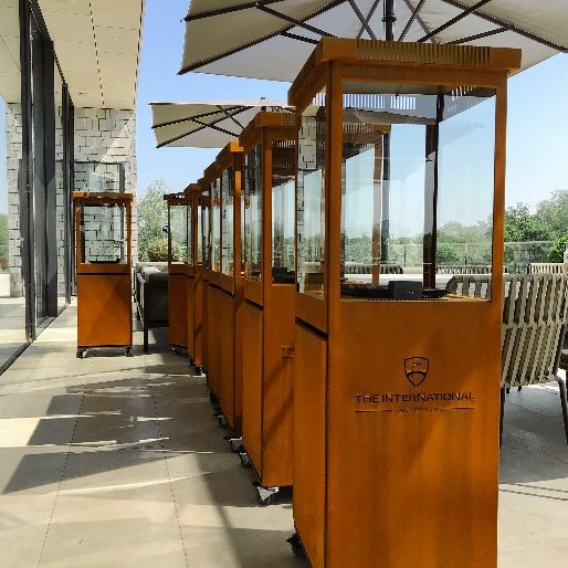 Corten patio heaters along a restaurant walkway