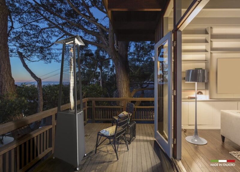 Italkero Dolce Vita glass tube tower patio heater on a deck at dusk
